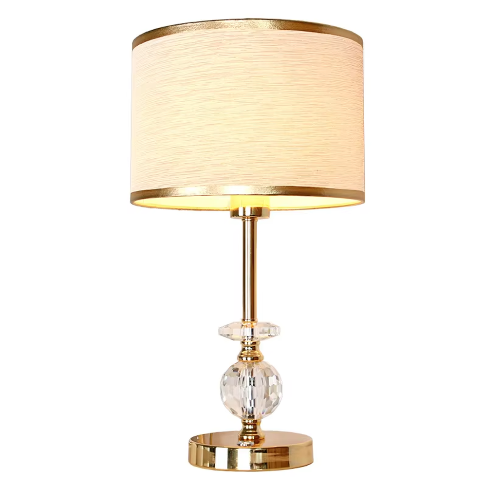 Modern light luxury gold-trimmed white shade golden pole cut crystal decorative table lamp, warm light effect, creating an exquisite and elegant atmosphere.