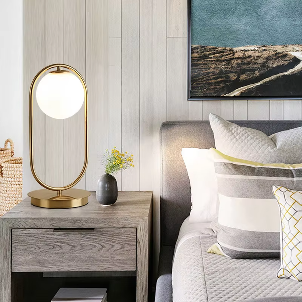 Minimalist gold ring glass ball table lamp (gold ring stand + milk white glass ball), warm light effect, creating a simple and high-end light luxury home atmosphere.