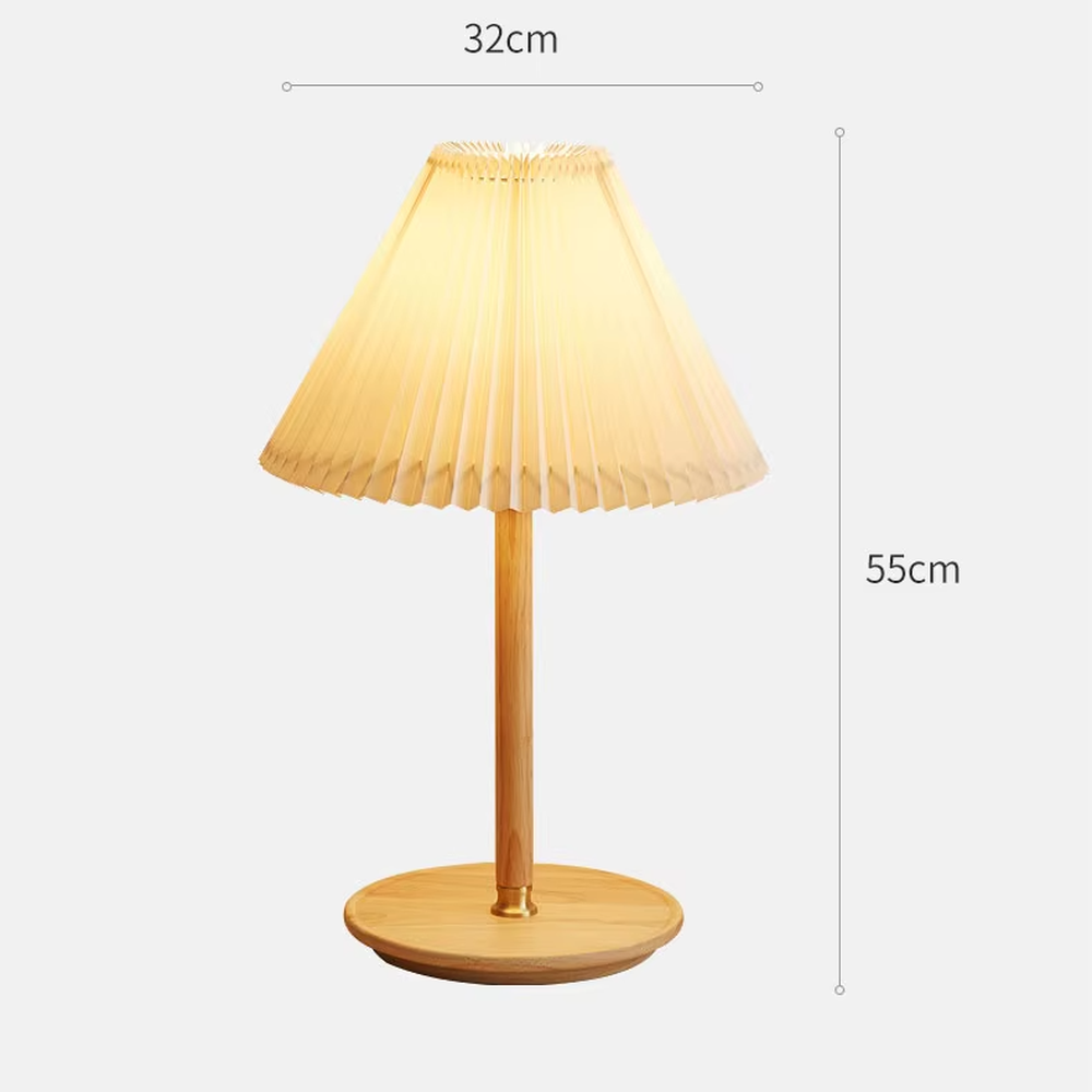Nordic-style wooden pleated table lamp, with a light wood lamp pole and base paired with an orange pleated fabric lampshade, providing soft and warm light, designed to enhance the cozy atmosphere of spaces, suitable for bedroom nightstands, living room side tables, homestay guest rooms, etc.