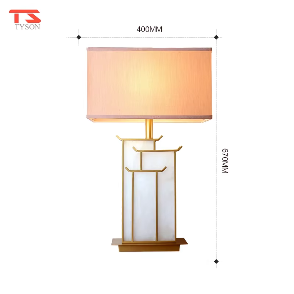 This is a new Chinese style table lamp, featuring a rectangular fabric lampshade paired with a geometric splicing base with Chinese architectural elements, which has both lighting and decorative functions, suitable for bedrooms, studies, tea rooms, new Chinese-style homes and hotel guest rooms and other spaces.