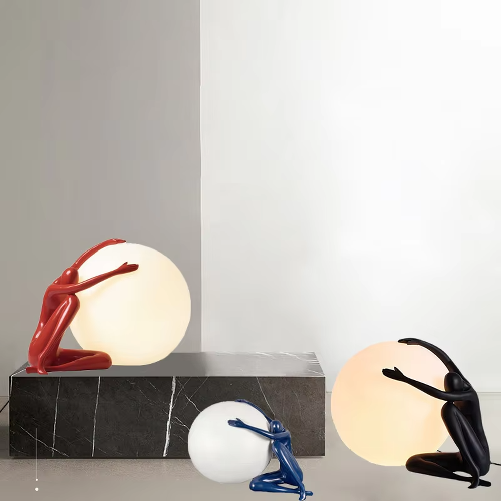 Artistic deep blue humanoid sculpture embracing spherical soft light table lamp, warm light effect, creating a high-end creative artistic space atmosphere.