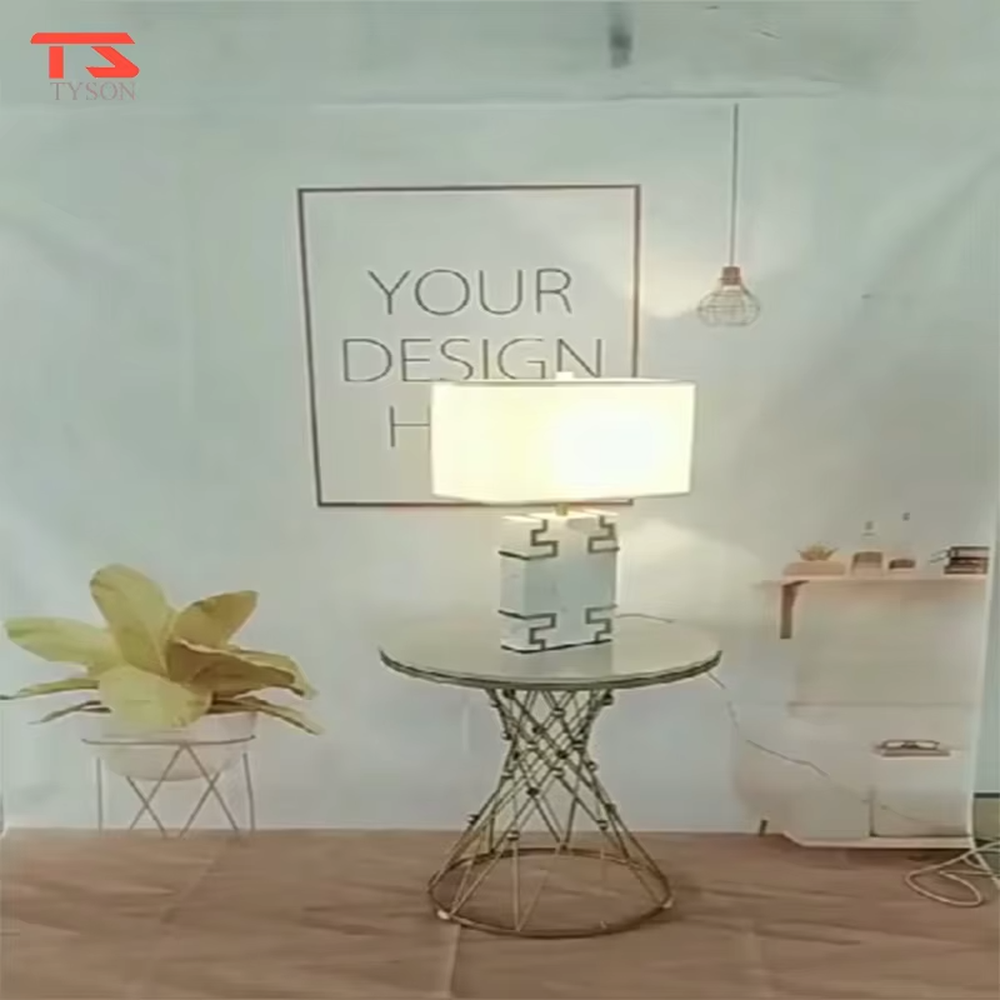 New Chinese light luxury style marble pattern table lamp, with a white faux marble lamp body paired with gold metal fretwork decoration, and a rectangular off-white fabric lampshade. It emits soft and elegant light, combining decorativeness and practicality, suitable for lighting and decoration in spaces such as bedroom nightstands, living room side tables, and New Chinese style show flats.