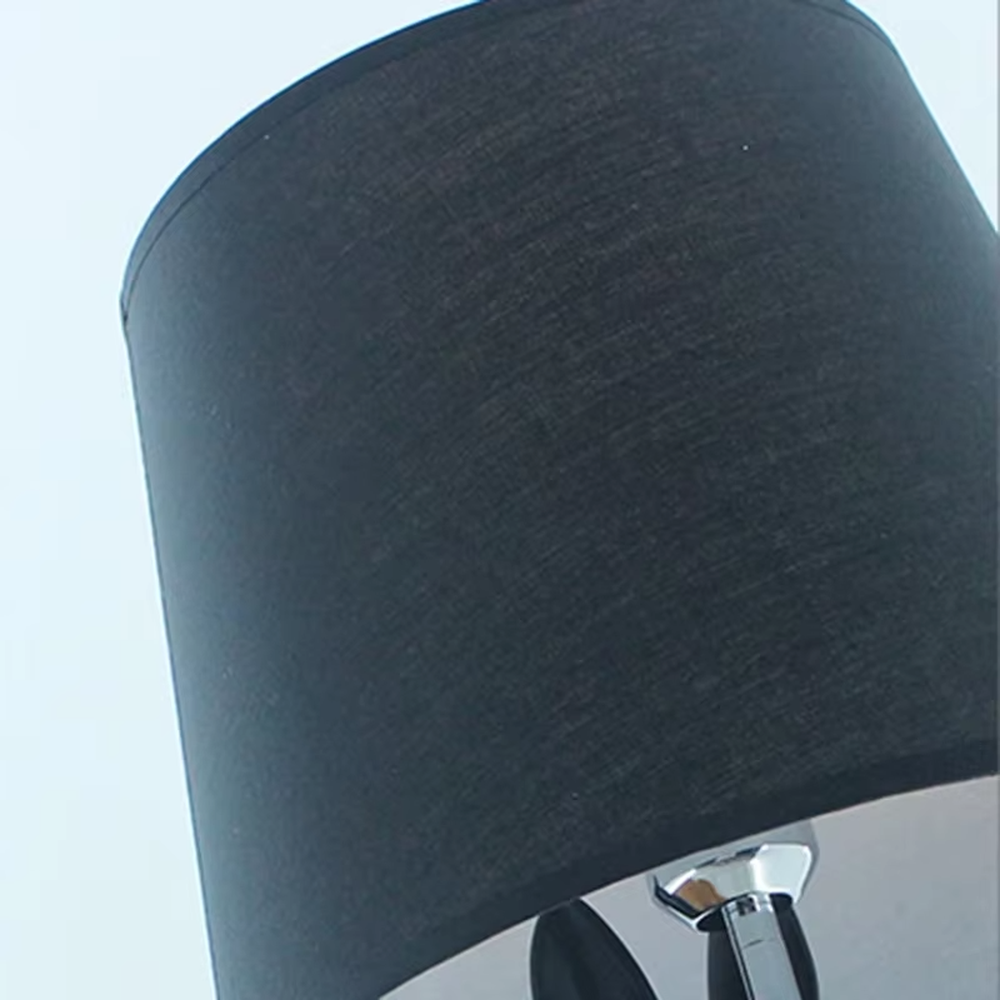 This dark art style table lamp features a bionic rabbit-shaped base made of black resin, paired with a black fabric cylindrical lampshade. The rabbit-lifting-lampshade design is full of fantasy, serving both lighting and decorative purposes, ideal for trendy toy spaces, personalized homes, internet-famous shops and other scenarios.