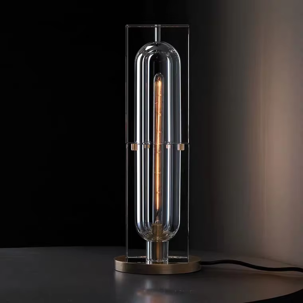 Modern light luxury crystal column table lamp, with a transparent cut crystal outer frame paired with a central gold metal luminous body, and a gold metal base at the bottom, emitting soft and transparent light, combining decorativeness and practicality, suitable for lighting and decoration in spaces such as console tables, living room side tables, study desks, and hotel guest rooms.
