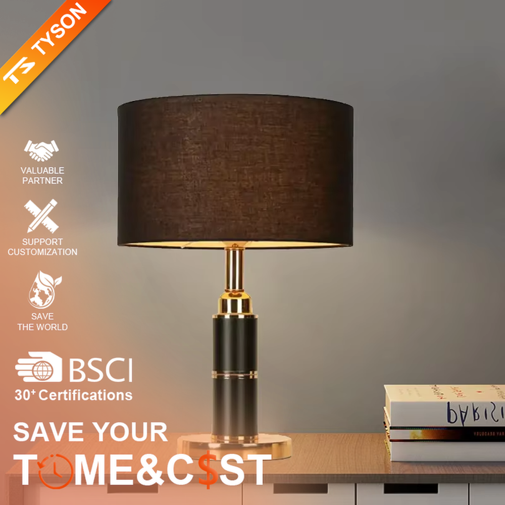 Light luxury brown fabric shade black-gold cylindrical base table lamp, warm light effect, creating a calm and high-end space atmosphere.