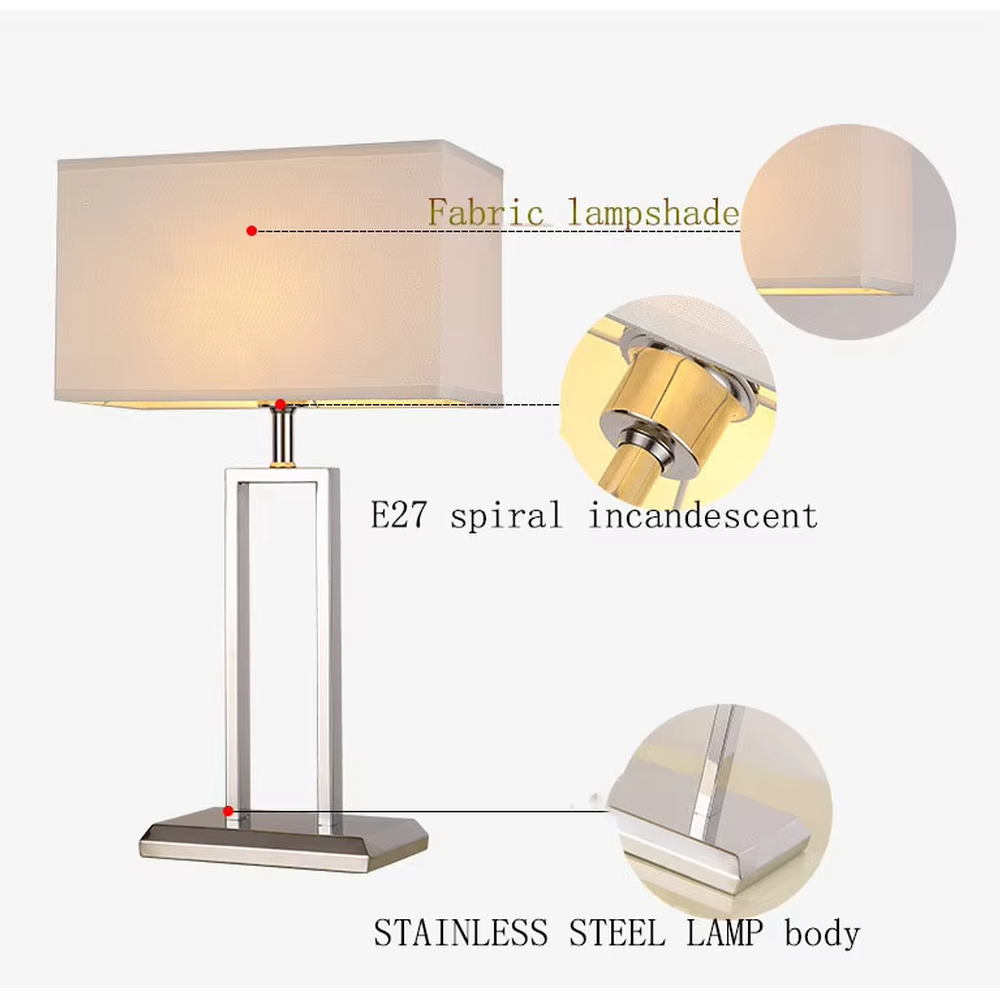 Modern minimalist geometric metal table lamp (bright chrome hollow lamp base + rectangular fabric lampshade), warm light effect, creating an exquisite and high-end home and office atmosphere.