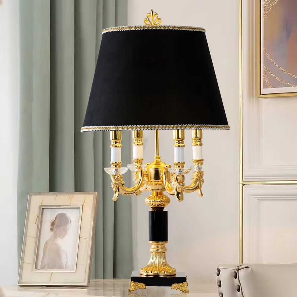 This European court-style table lamp features a carved lamp frame made of glossy gold metal, paired with a crystal ball base and a pleated fabric lampshade (trimmed with gold edging). It presents a luxurious and retro texture, with soft and warm light, serving both lighting and decorative purposes, suitable for European-style bedrooms, villa guest rooms and other spaces.