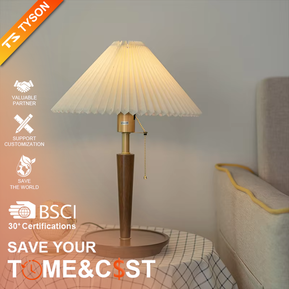 Vintage Nordic pleated fabric table lamp, with an off-white pleated fabric lampshade paired with a dark brown wood and gold metal spliced lamp pole, featuring a pull-cord switch, emitting soft and warm light, combining decorativeness and practicality, suitable for lighting and decoration in spaces such as bedroom nightstands, living room side tables, and B&B guest rooms.