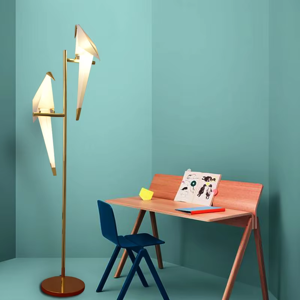 This artistic origami crane-shaped table lamp features a gold metal stand and base, paired with a translucent material to create an origami crane lampshade. It serves both lighting and decorative purposes, ideal for light luxury art-style spaces such as bedroom bedside tables, living room side tables, and hotel guest rooms.