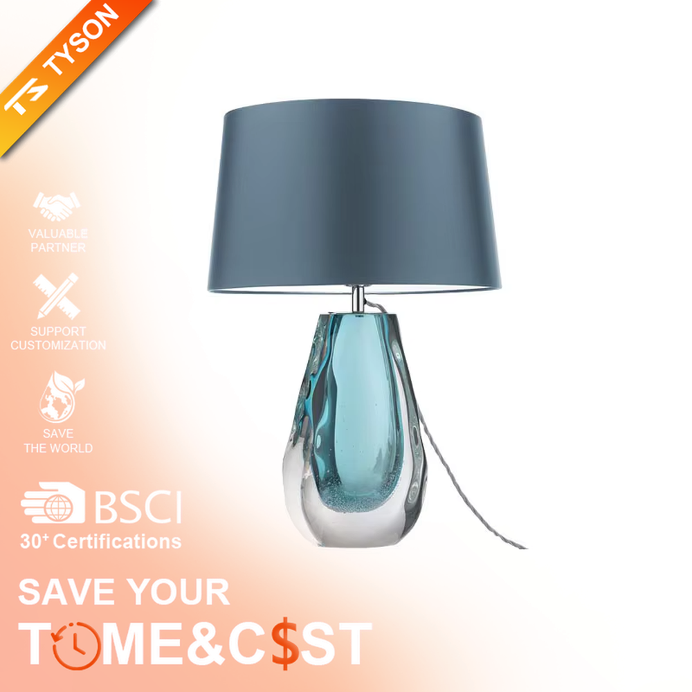 This is a fresh light luxury glass table lamp, with a royal blue fabric lampshade paired with a blue-green gradient hand-blown glass base, featuring both decorative and lighting functions, ideal for warm indoor scenarios such as bedroom nightstands and living room side tables.