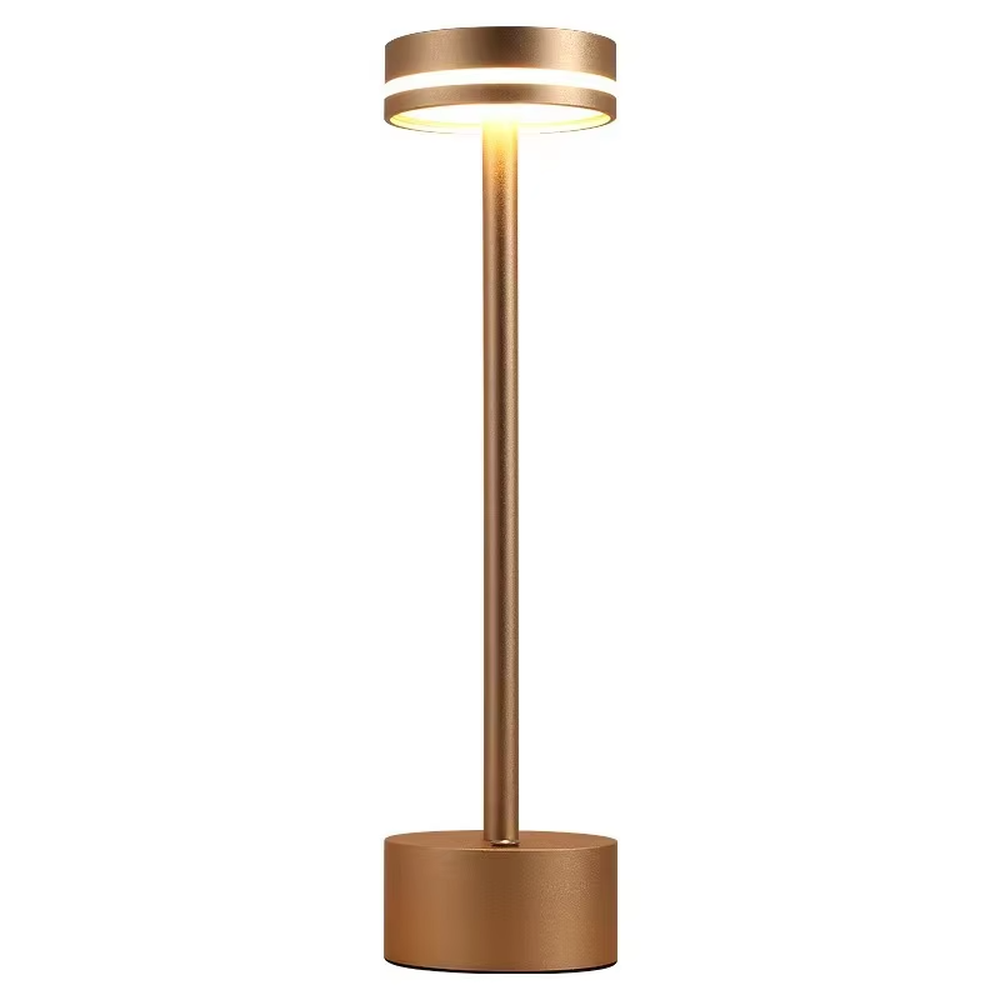 Modern minimalist bronze metal rechargeable table lamp, featuring a cylindrical lamp body and a top ring-shaped lighting design, emitting soft and even light. It supports wireless battery life and touch dimming, suitable for ambient lighting and supplementary lighting in scenarios such as dining tables, bars, and bedroom nightstands.