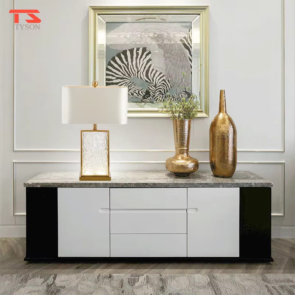 This modern light luxury table lamp features a gold metal frame, paired with a water-textured transparent glass lamp body and a white fabric rectangular lampshade. It serves both lighting and decorative purposes, ideal for light luxury spaces such as bedroom bedside tables, living room side tables, and hotel guest rooms.