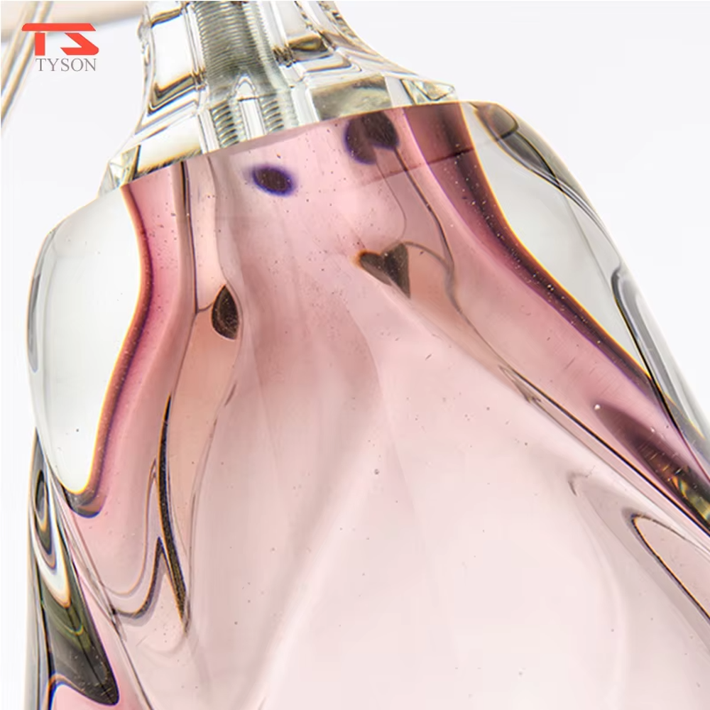 Modern art pink waterdrop glass base beige fabric shade table lamp, warm light effect, creating an elegant artistic atmosphere.