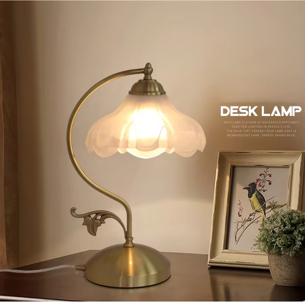 Vintage pastoral style flower-shaped table lamp, with a black wrought iron curved lamp pole with leaf decoration, paired with a white frosted glass petal lampshade. It emits soft and warm light, combining decorativeness and practicality, suitable for lighting and decoration in spaces such as bedroom nightstands, study desks, and B&B guest rooms.