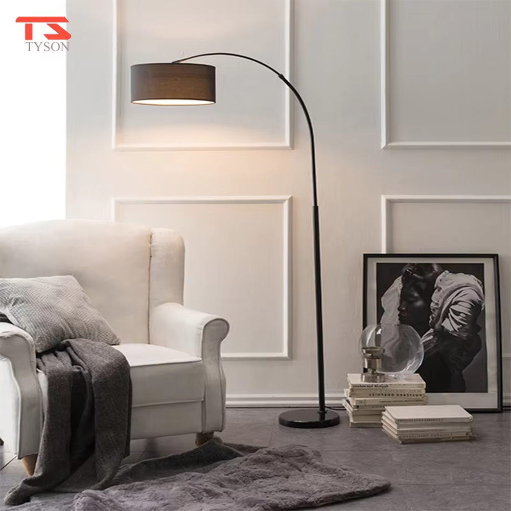 This is a modern minimalist arc floor lamp, featuring a white metal arc pole, a marble base, and a white fabric lampshade, with a simple and elegant design. It is used to provide local lighting and decorate the space, combining practicality and aesthetics. It is suitable for modern home living room corners, bedroom reading areas, high-end hotel leisure areas, luxury apartment living spaces and other places.