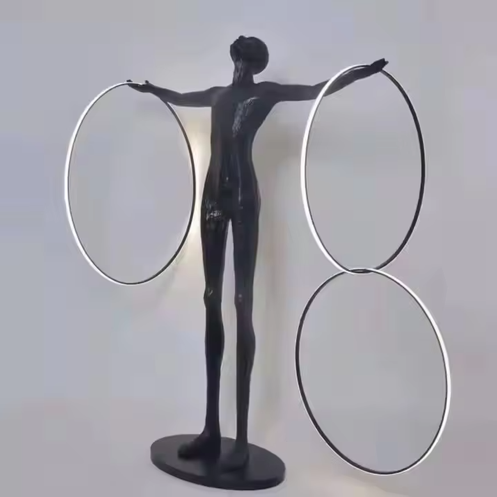 This is an artistic sculpture floor lamp, featuring a black human sculpture holding a circular luminous lamp, with a marble base. It is highly artistic and creative in design. It is used for space lighting and artistic decoration, significantly enhancing the artistic atmosphere and style of the space. It is suitable for modern art - style homes, high - end hotel lobbies, art exhibition halls, luxury clubs and other places.