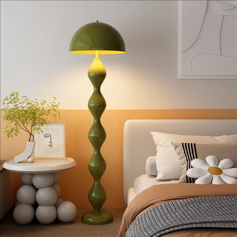 This is a modern artistic floor lamp with an olive green wavy lamp pole and a dome lampshade, featuring a unique and dynamic design. It is used for space lighting and decoration, creating a warm and artistic ambiance. It is suitable for modern home bedrooms, living rooms, characteristic homestays, art apartments and other places.