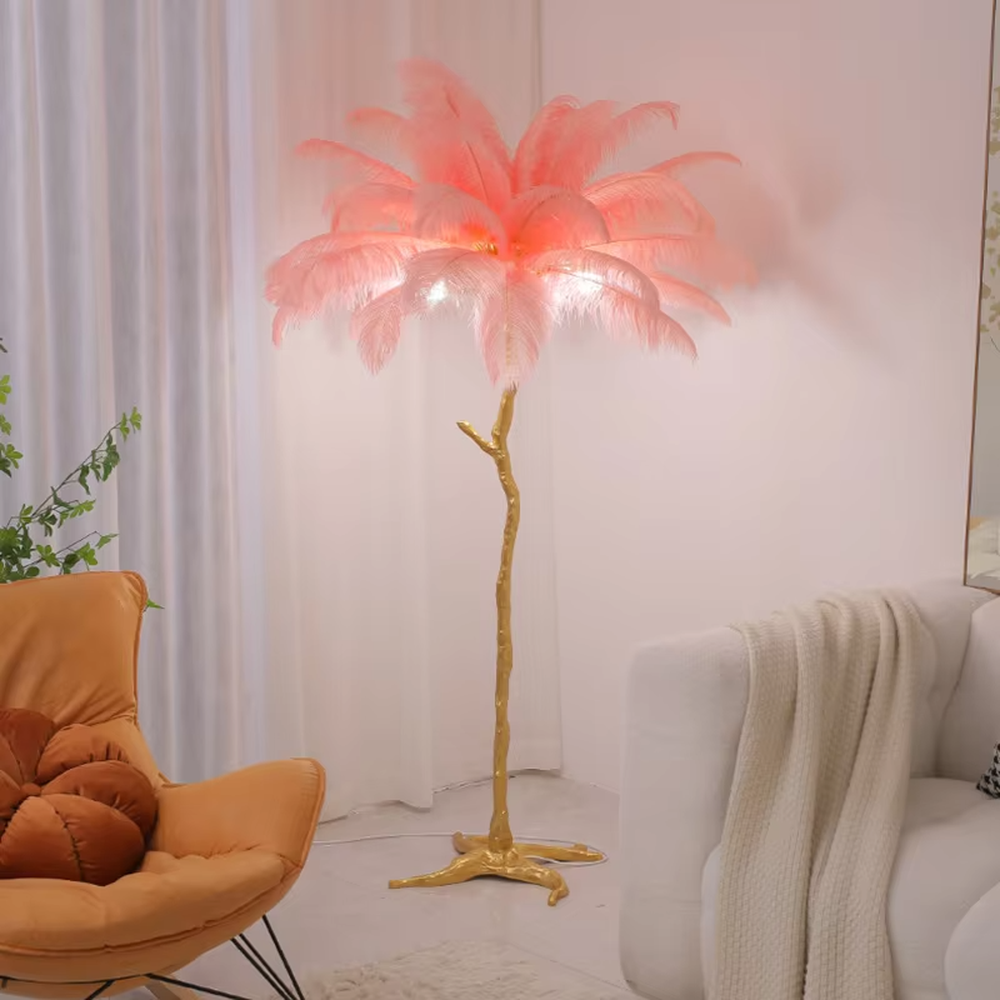 This is a light luxury artistic feather-shaped floor lamp, with a golden branch-shaped metal bracket and numerous pink ostrich feathers. It features a romantic and luxurious design, with warm and soft lighting. It is used for space ambient lighting and decoration, creating a romantic artistic atmosphere. Suitable for light luxury-style bedrooms, internet-famous check-in shops, art homestays and other places.