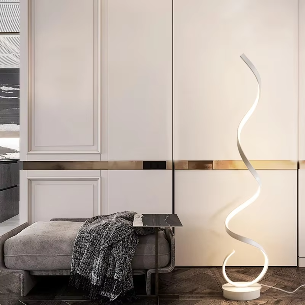 This is a modern artistic spiral floor lamp, with a white spiral shape and a minimalist base, featuring a strong artistic sense and modern style. It is used for space lighting and decoration, creating an artistic atmosphere. It is suitable for modern art home living rooms, designer studios, art exhibition halls and other places.