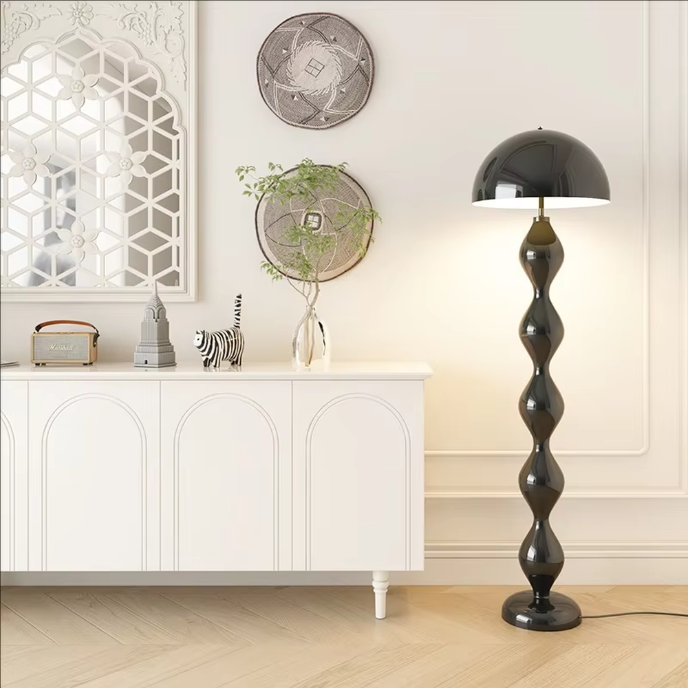 This is a modern artistic floor lamp with an olive green wavy lamp pole and a dome lampshade, featuring a unique and dynamic design. It is used for space lighting and decoration, creating a warm and artistic ambiance. It is suitable for modern home bedrooms, living rooms, characteristic homestays, art apartments and other places.