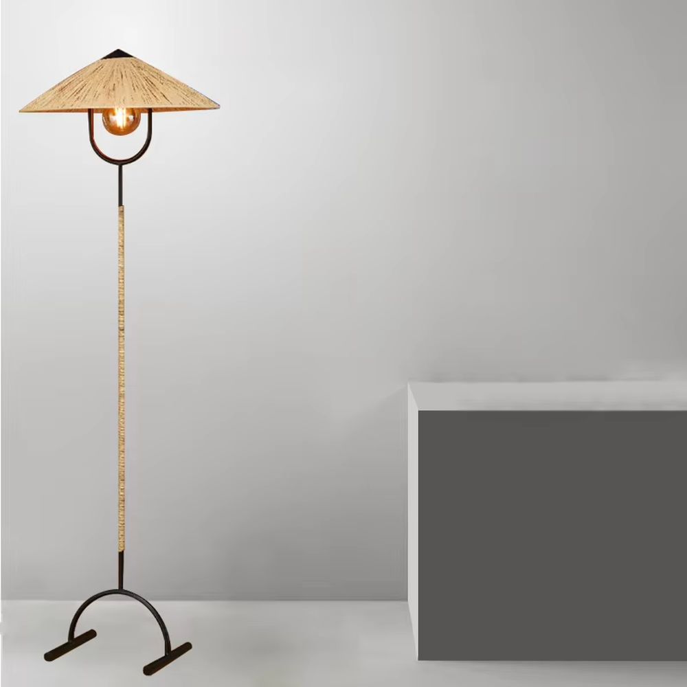 This is a retro-style woven floor lamp, with a black metal stand (curved base) and a woven-textured conical lampshade, featuring a retro bulb design, natural retro style and unique texture. It is used for space lighting and decoration, creating a warm retro natural atmosphere. It is suitable for retro-style home living rooms, leisure areas, art studios and other places.