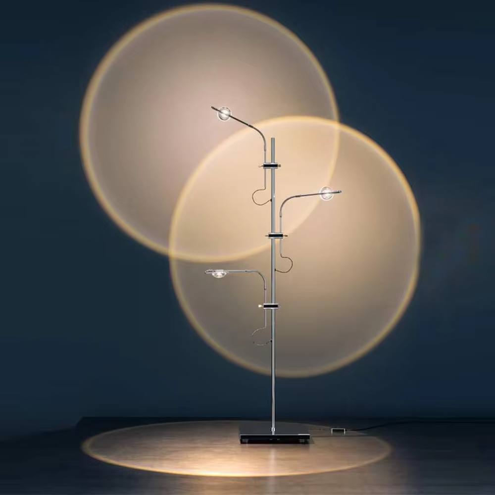 This is a modern artistic multi-circular light and shadow floor lamp, with a metal branch-like structure and multiple circular light-emitting panels. The light projects circular light and shadow with yellow edges, featuring a strong sense of modern art and light-shadow hierarchy. It is used for space lighting and decoration, creating a warm and artistic atmosphere. Suitable for modern bedrooms, artistic living rooms, designer studios and other places.