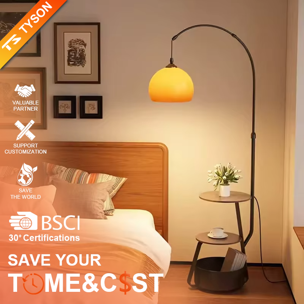 This is a modern multi-functional floor lamp with a curved metal pole, a gradient orange-yellow spherical lampshade, and integrated multi-layer storage shelves, featuring a minimalist and practical design. It is used for space lighting, storage, and decoration, creating a warm and practical atmosphere. It is suitable for modern home living rooms, small-sized residences, creative studios and other places.