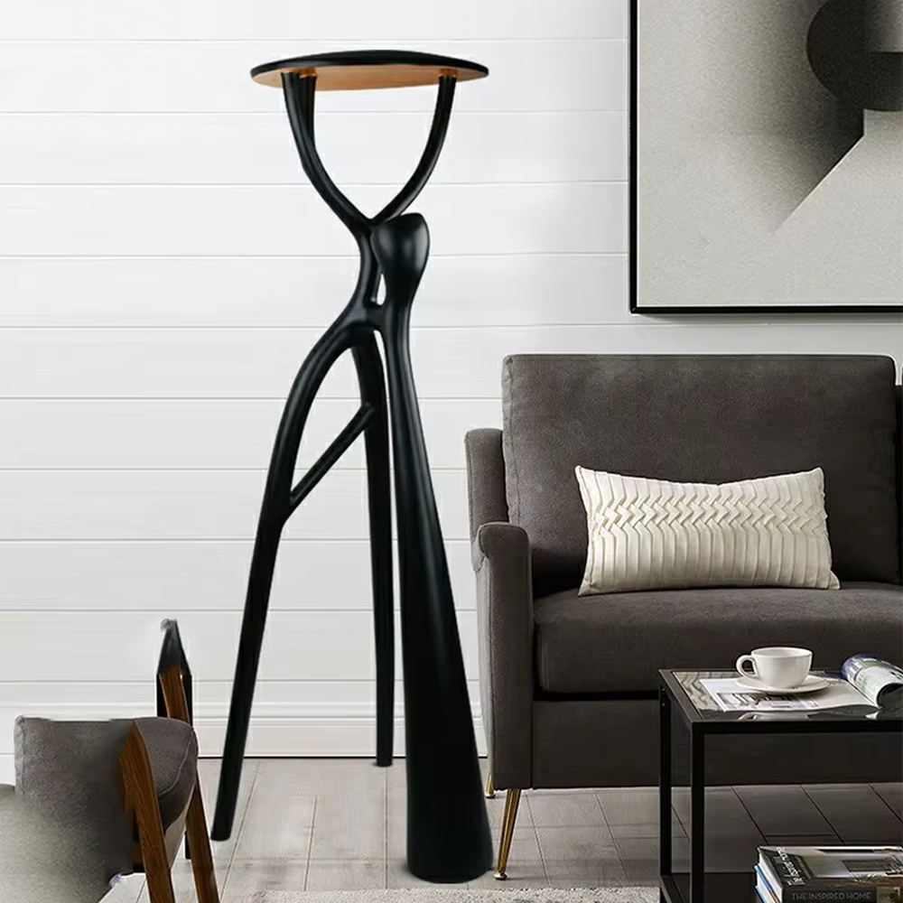 This is a modern artistic human-shaped floor lamp with a black creative human-like bracket and a wooden top lamp plate. It features a highly artistic design with a modern sense. It is used for space lighting and decoration, creating an artistic and distinctive ambiance. It is suitable for modern art-style home living rooms, creative studios, high-end art galleries and other places.
