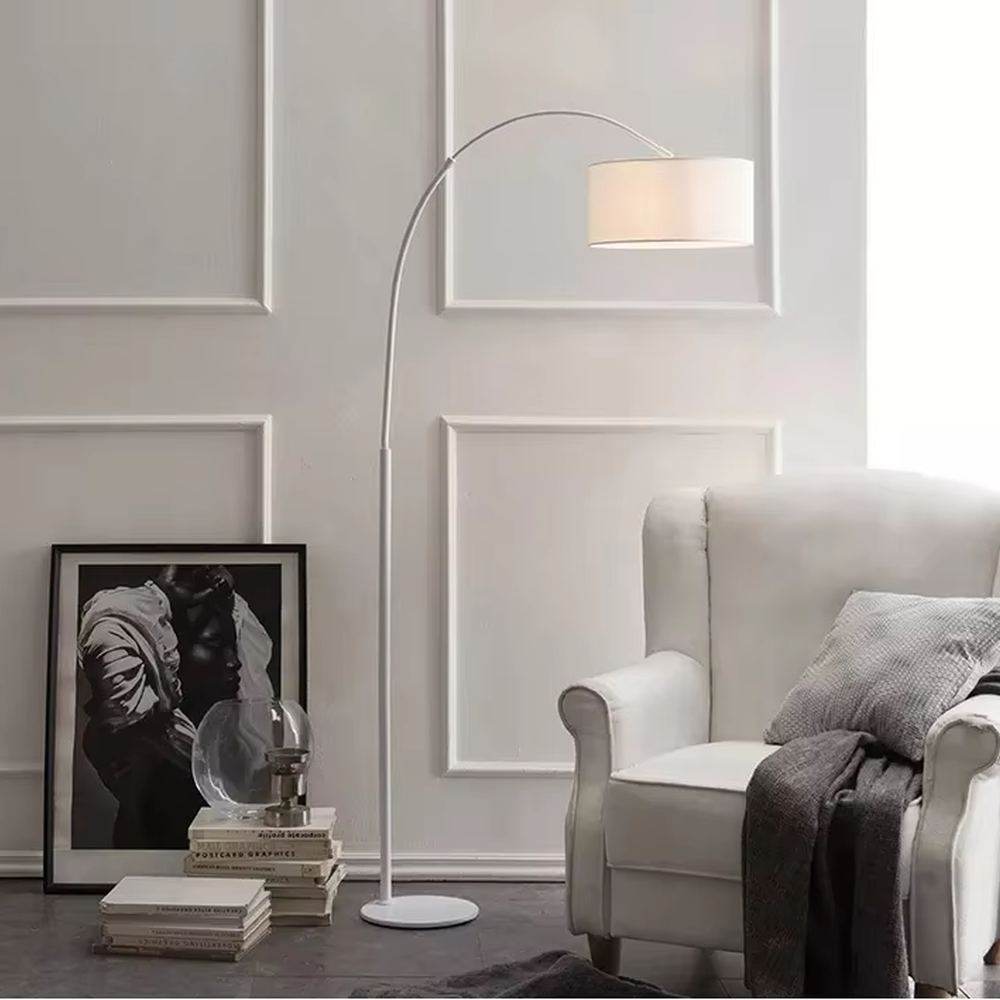 This is a modern minimalist black arc fabric floor lamp, with a black metal arc pole paired with a black fabric round lampshade. It features a minimalist and grand design, with soft lighting. It is used for space accent lighting and decoration, creating a modern minimalist atmosphere. Suitable for modern minimalist living rooms, Nordic-style homes, study corners and other places.