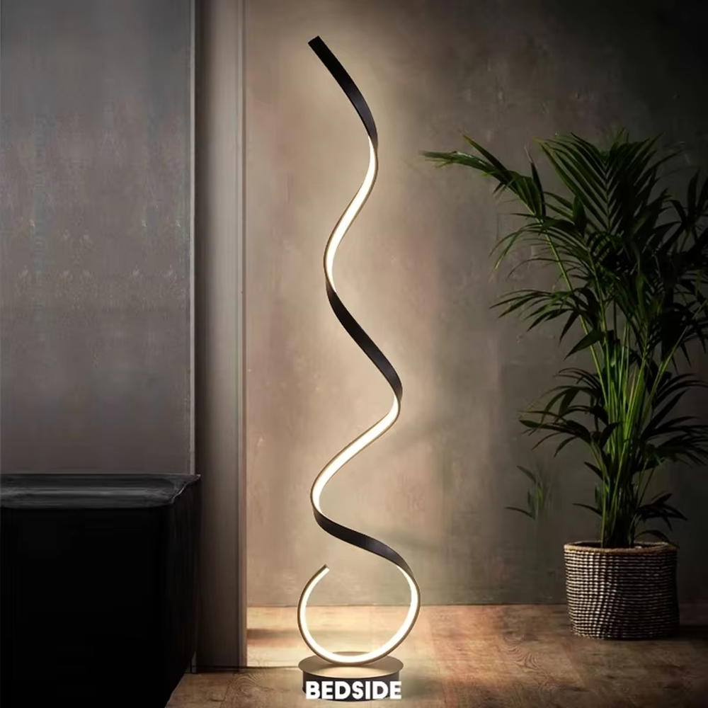 This is a modern artistic spiral floor lamp, with a white spiral shape and a minimalist base, featuring a strong artistic sense and modern style. It is used for space lighting and decoration, creating an artistic atmosphere. It is suitable for modern art home living rooms, designer studios, art exhibition halls and other places.