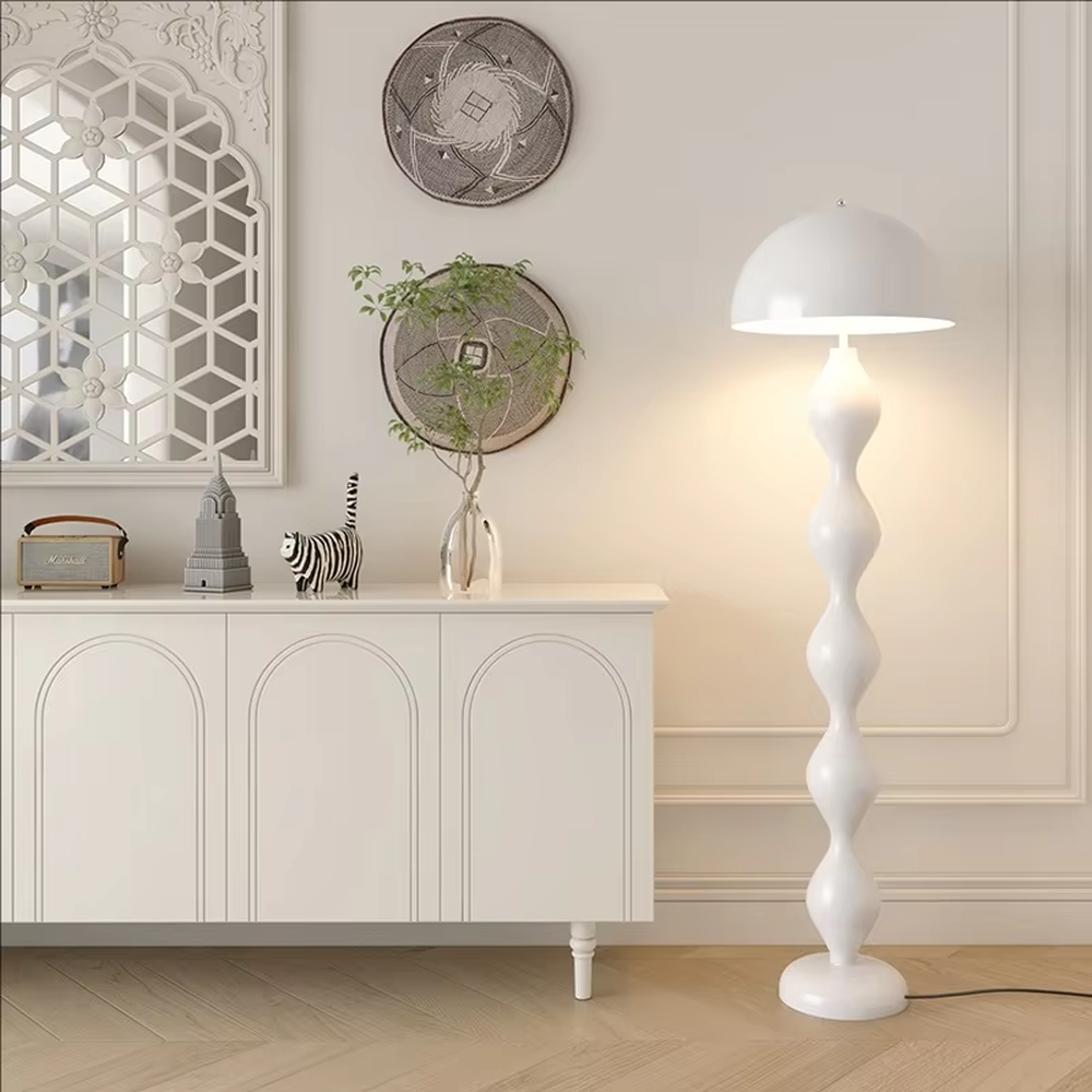 This is a modern artistic floor lamp with an olive green wavy lamp pole and a dome lampshade, featuring a unique and dynamic design. It is used for space lighting and decoration, creating a warm and artistic ambiance. It is suitable for modern home bedrooms, living rooms, characteristic homestays, art apartments and other places.