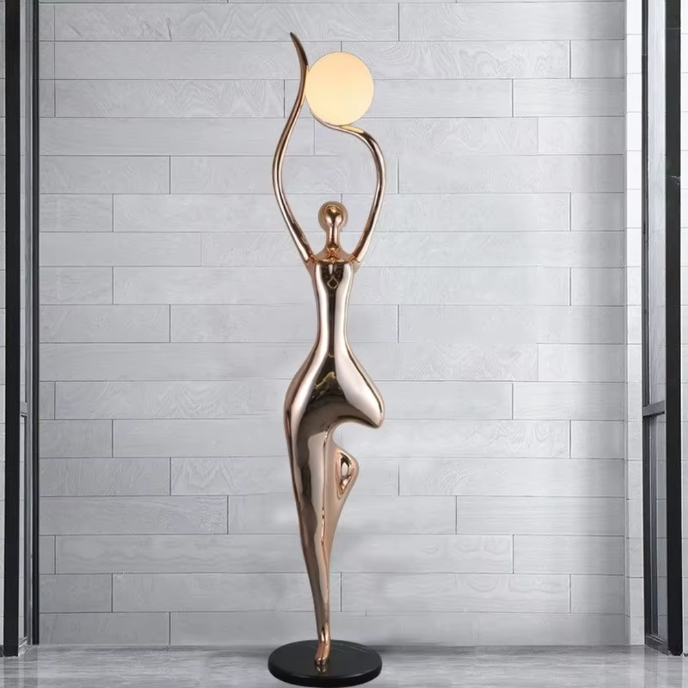 This is a modern artistic human-shaped floor lamp with a rose gold artistic human figure and a spherical lampshade, featuring a strong sense of art and modernity. It is used for space lighting and decoration, creating an artistic and distinctive ambiance. It is suitable for modern art-style homes, high-end clubs, art exhibition halls and other places.