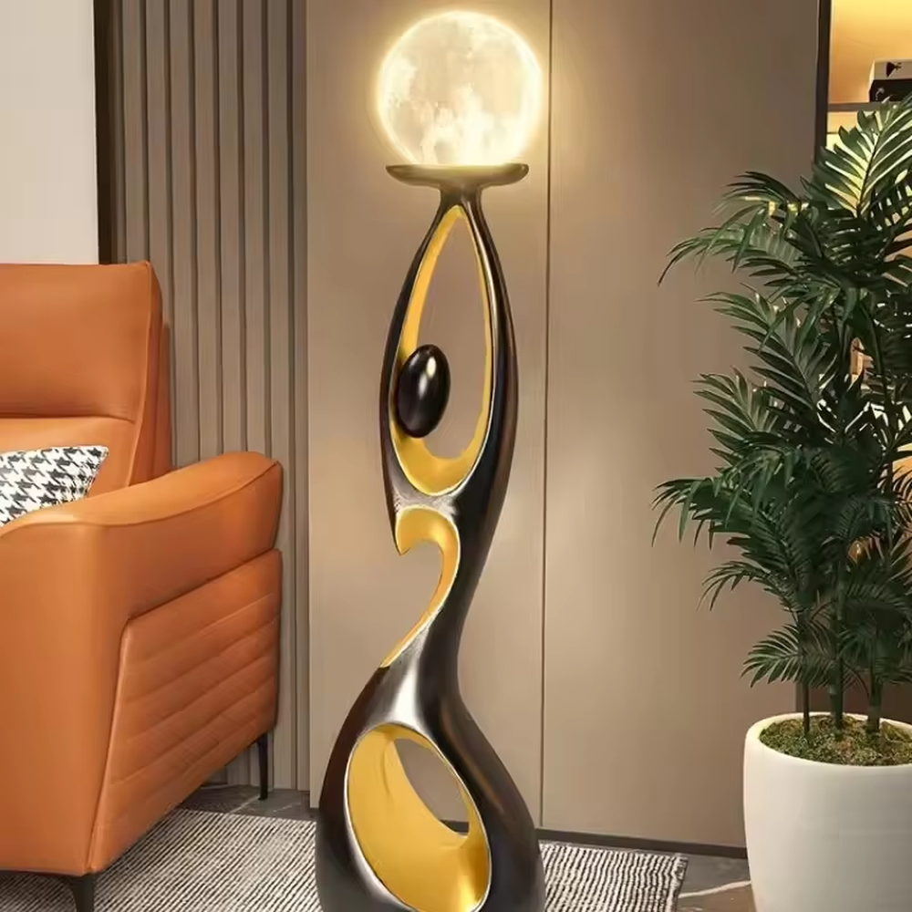 This is an artistic human-shaped black-gold floor lamp, featuring a black-gold artistic human sculpture holding a moon-shaped luminous lamp, with strong artistic sense and modern luxury style. It is used for space lighting and decoration, creating an artistic atmosphere. It is suitable for modern art home living rooms, high-end hotel lobbies, art exhibition halls and other places.