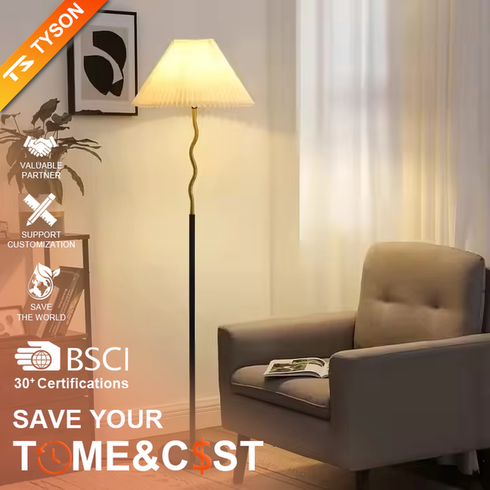 This is a modern minimalist black spherical decorative floor lamp, with a black metal pole featuring spherical decorative elements and a beige pleated fabric lampshade. It has a minimalist and textured design, with soft and warm lighting. It is used for space lighting and decoration, creating a warm and comfortable atmosphere. Suitable for modern minimalist living rooms, bedroom corners, Nordic-style homes and other places.