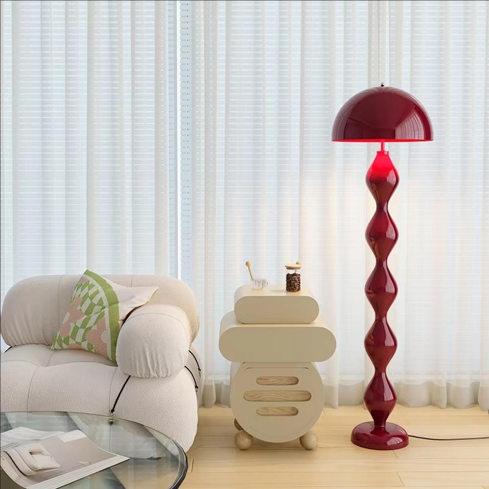 This is a modern artistic floor lamp with an olive green wavy lamp pole and a dome lampshade, featuring a unique and dynamic design. It is used for space lighting and decoration, creating a warm and artistic ambiance. It is suitable for modern home bedrooms, living rooms, characteristic homestays, art apartments and other places.