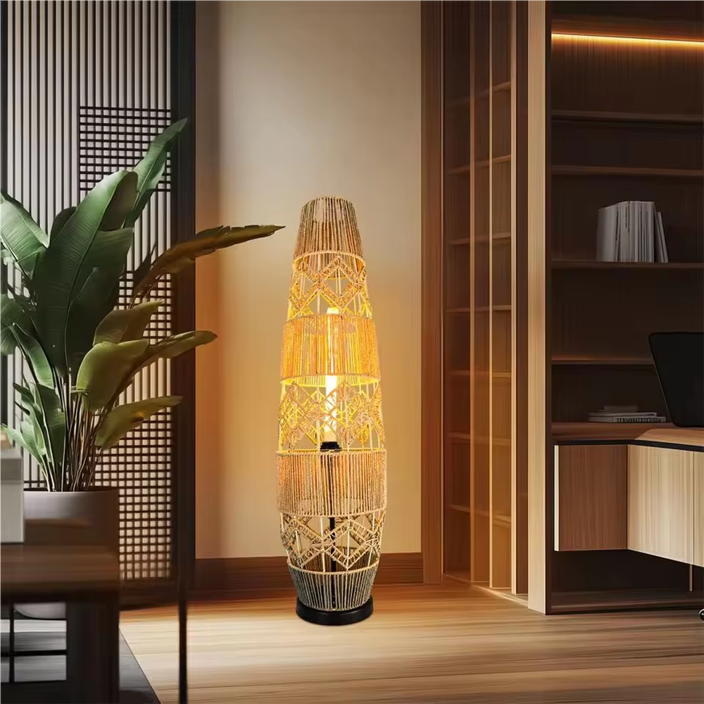 This is a natural retro-style rattan floor lamp, with a multi-layer geometric woven rattan structure, featuring a natural artistic sense and warm rustic texture. It is used for space lighting and decoration, creating a natural and warm retro atmosphere. It is suitable for natural-style home living rooms, homestay leisure areas, Southeast Asian-style restaurants and other places.