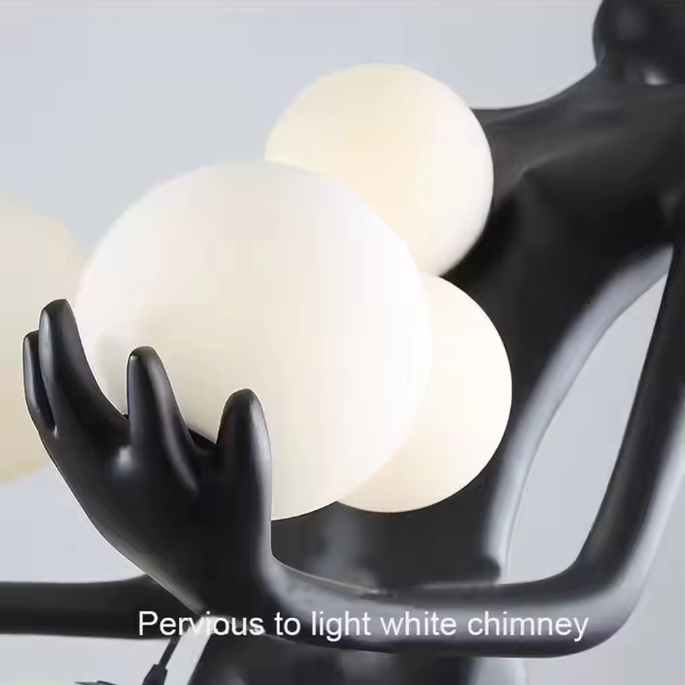 This is an artistic installation-style figure sculpture floor lamp, with a black figure sculpture sitting on a white marble base, holding a circular luminous lamp with both hands, featuring strong artistic sense. It is used for space lighting and artistic decoration, creating a modern artistic atmosphere. Suitable for art exhibition halls, high-end hotel lobbies, corners of modern art home living rooms and other places.