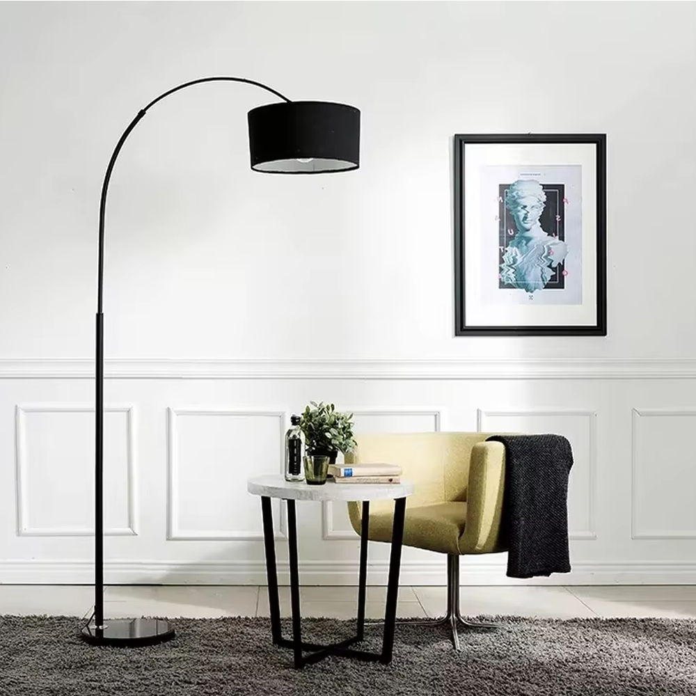 This is a modern minimalist black arc fabric floor lamp, with a black metal arc pole paired with a black fabric round lampshade. It features a minimalist and grand design, with soft lighting. It is used for space accent lighting and decoration, creating a modern minimalist atmosphere. Suitable for modern minimalist living rooms, Nordic-style homes, study corners and other places.