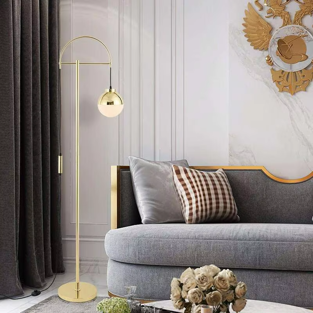 Light luxury golden curved metal floor lamp, spherical gold-frame white shade + round base, soft lighting, creating a high-end elegant atmosphere.