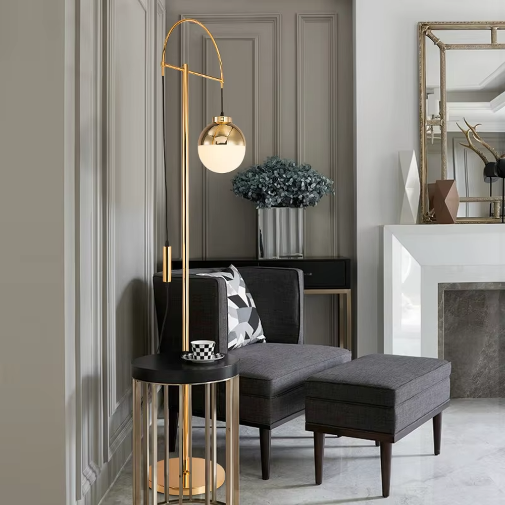 Light luxury golden curved metal floor lamp, spherical gold-frame white shade + round base, soft lighting, creating a high-end elegant atmosphere.
