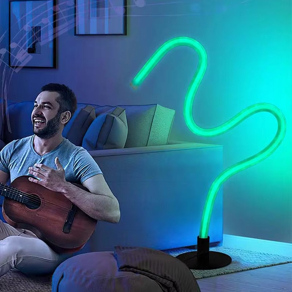 Modern creative bendable RGB neon floor lamp, fluorescent colorful light strip + black base, dynamic and changeable lighting, creating a trendy leisure atmosphere.