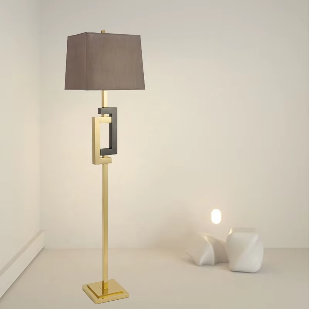 Light luxury black-gold geometric decorative floor lamp, golden metal lamp pole + dark brown square fabric lampshade, soft lighting, creating a high-end elegant atmosphere.