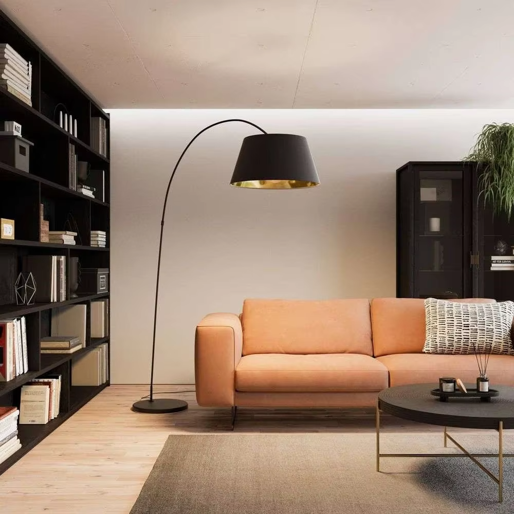 Modern minimalist curved floor lamp, black curved lamp pole paired with a black-outside-gold-inside hemisphere lampshade and a black disc base, soft and warm lighting, creating a minimalist high-end space atmosphere.