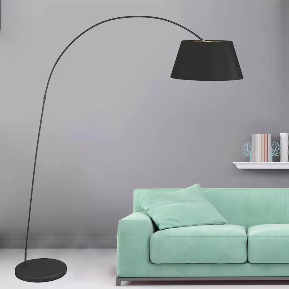 Modern minimalist curved floor lamp, black curved lamp pole paired with a black-outside-gold-inside hemisphere lampshade and a black disc base, soft and warm lighting, creating a minimalist high-end space atmosphere.