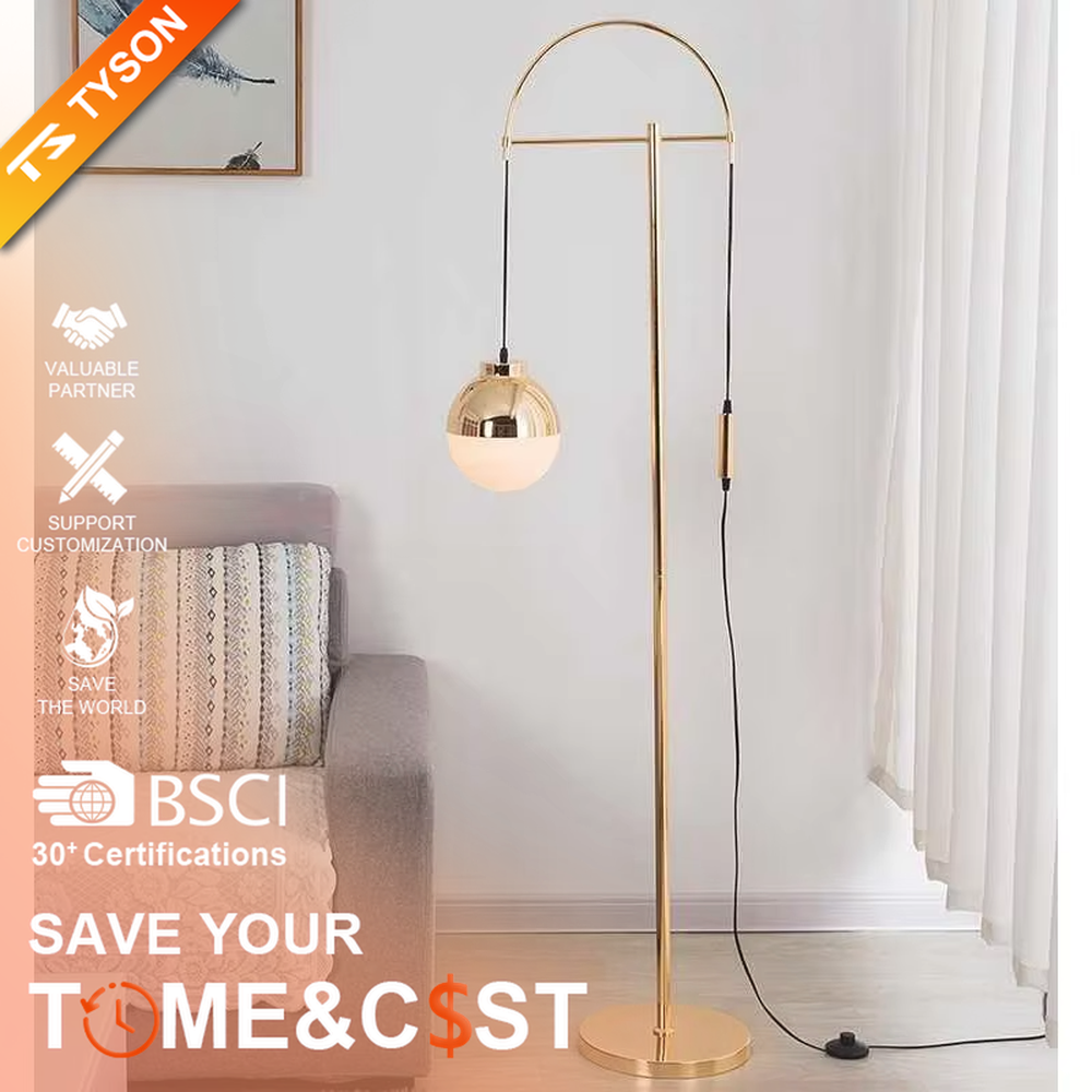 Light luxury golden curved metal floor lamp, spherical gold-frame white shade + round base, soft lighting, creating a high-end elegant atmosphere.