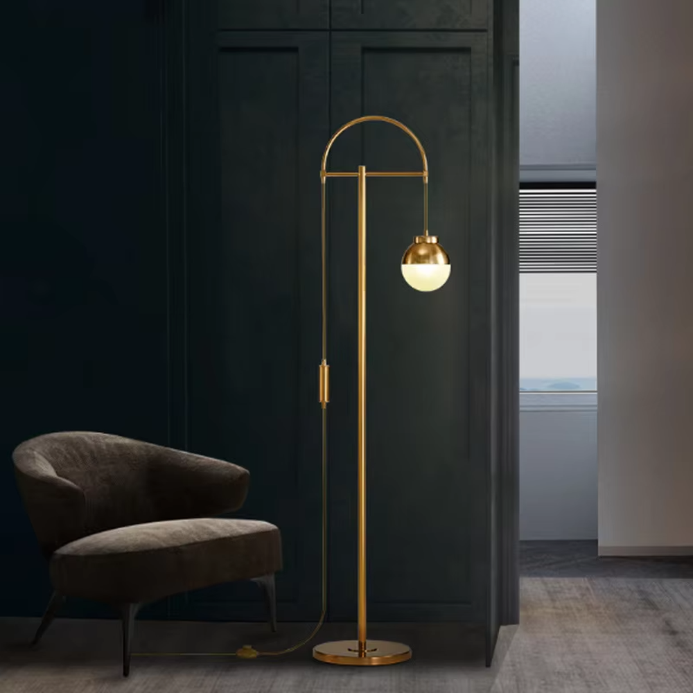 Light luxury golden curved metal floor lamp, spherical gold-frame white shade + round base, soft lighting, creating a high-end elegant atmosphere.