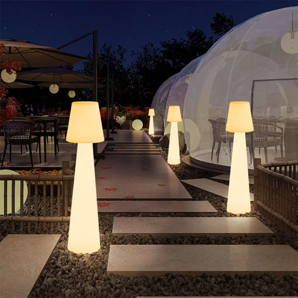 This is a modern ambiance-style fully luminous cone floor lamp, made of bright pink light-transmitting material to create a "small-top-large-bottom" cone shape. With a fully luminous design, its lighting is soft and bright-colored, creating a lively and fashionable space atmosphere.