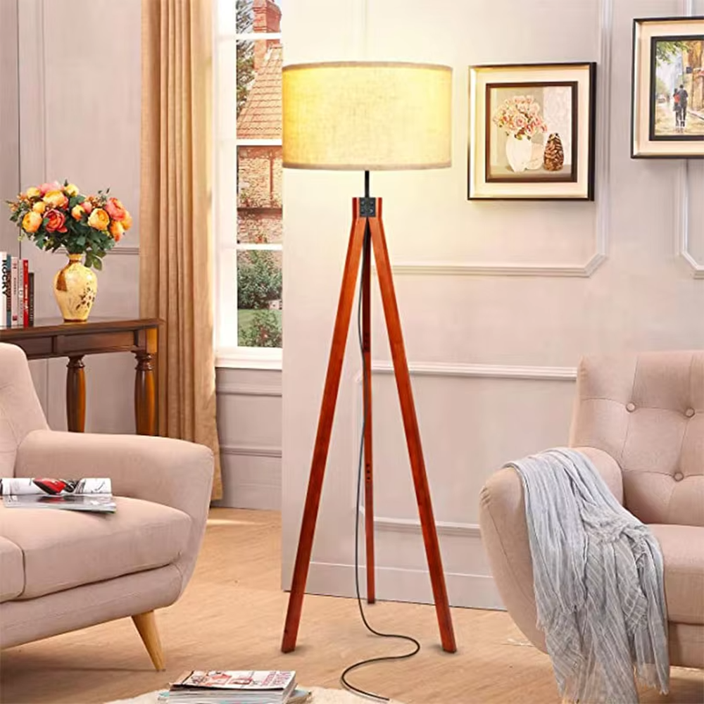 Vintage natural-style reddish-brown wooden tripod floor lamp, paired with beige fabric lampshade, soft and warm lighting, creating a natural and comfortable space atmosphere.