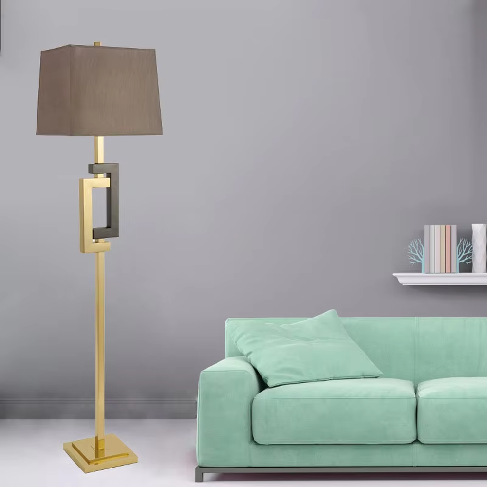 Light luxury black-gold geometric decorative floor lamp, golden metal lamp pole + dark brown square fabric lampshade, soft lighting, creating a high-end elegant atmosphere.