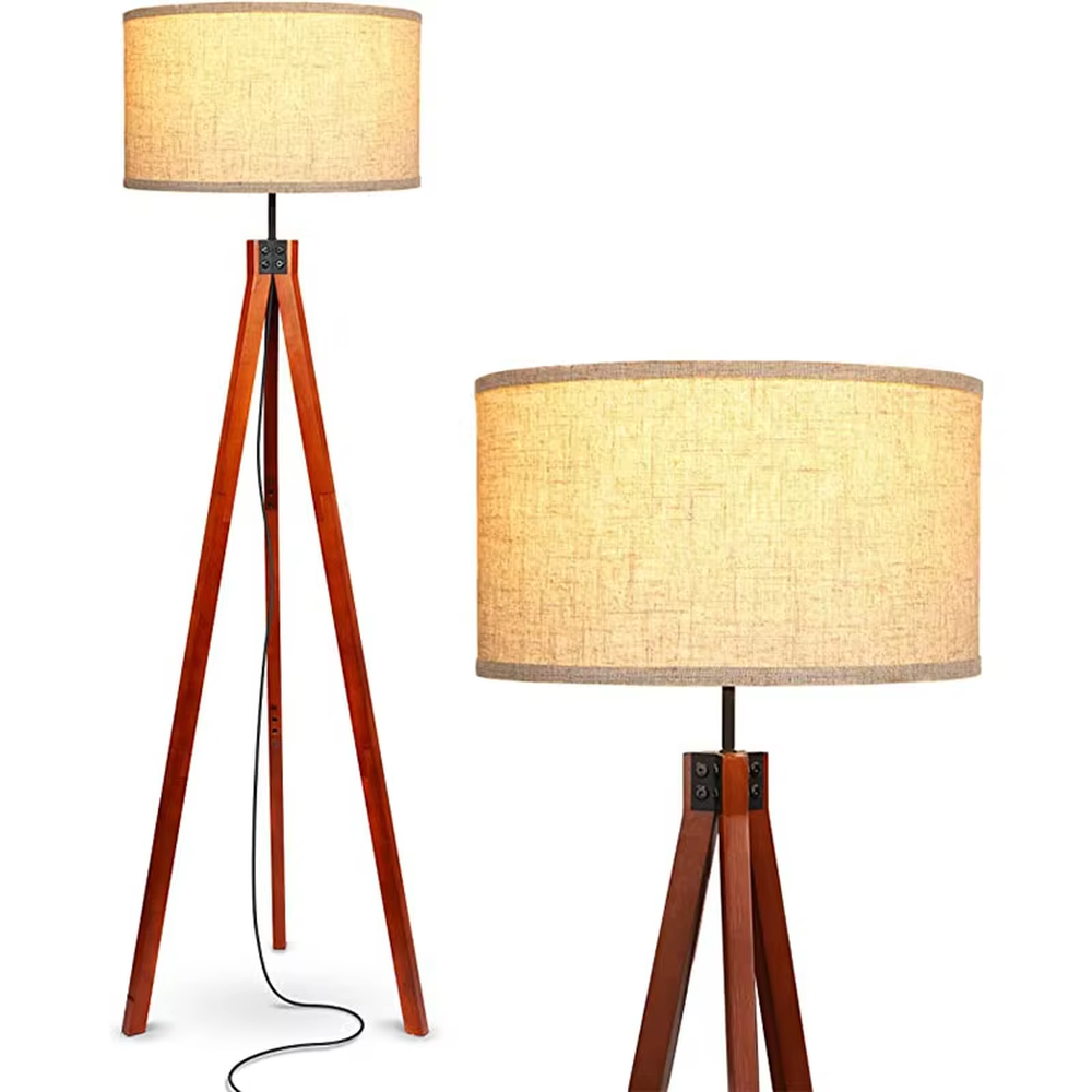 Vintage natural-style reddish-brown wooden tripod floor lamp, paired with beige fabric lampshade, soft and warm lighting, creating a natural and comfortable space atmosphere.
